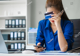 Stock Photo An Asian Businesswoman In A Blue Formal Shirt Is Working At Her Desk Analyzing Financial Charts On 2565990763 1