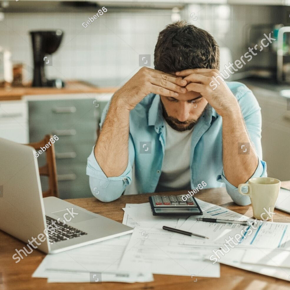 Stock Photo Stressed Young Man Managing Debt In Kitchen 2386264809